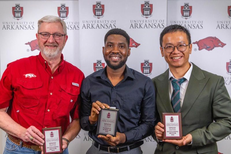 David David Setor Agogo-Mawuli holds his 2026 National Scholar award during the University of Arkansas State & National Awards Reception.